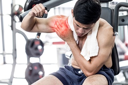 Man Working Out With A Shoulder Injury